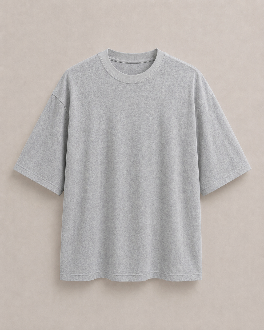 A light gray t-shirt with a relaxed, oversized fit, displayed flat against a neutral beige background. Hemp Horizon