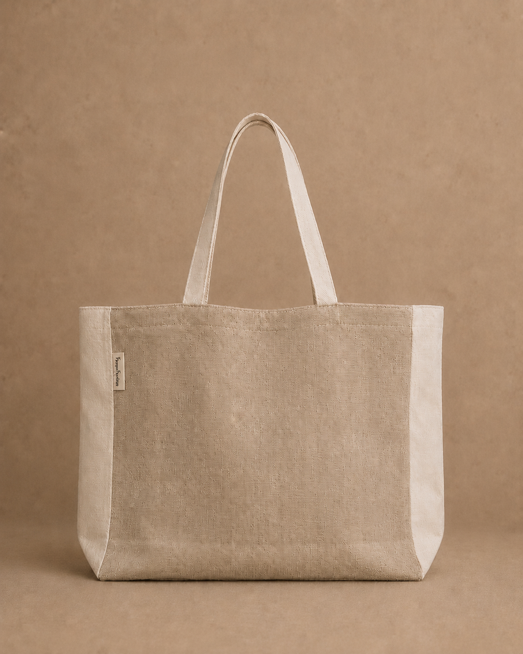 A Hemp canvas tote bag in a light beige color with cream-colored handles and side panels, shown against a matching textured beige background, with internal pocket - Hemp Horizon