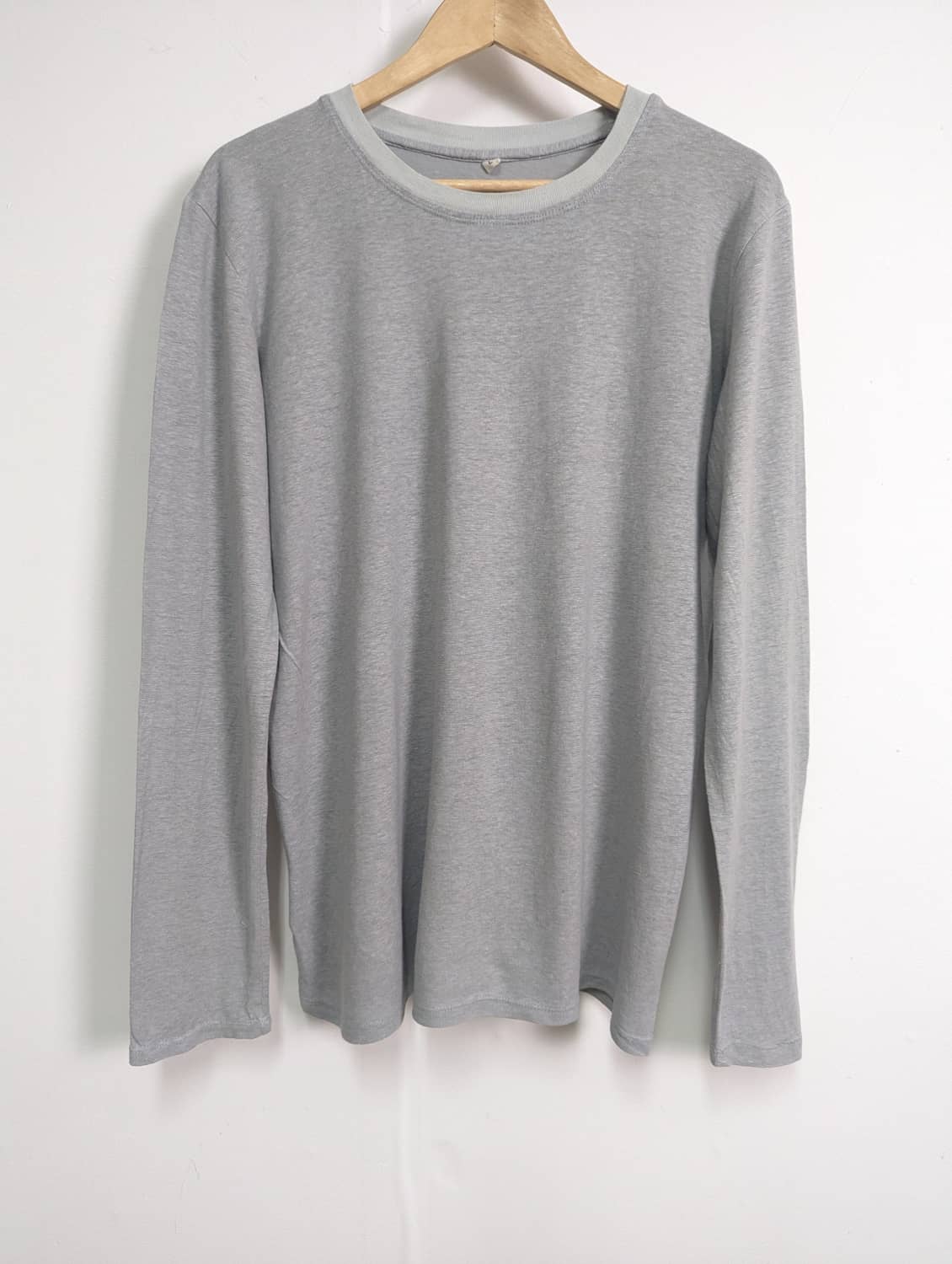Grey long-sleeved hemp t-shirt on a hanger