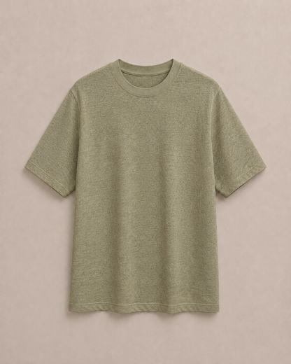 A short-sleeve pure Hemp t-shirt in a light Olive color, laid flat against a solid light beige background. Hemp Horizon