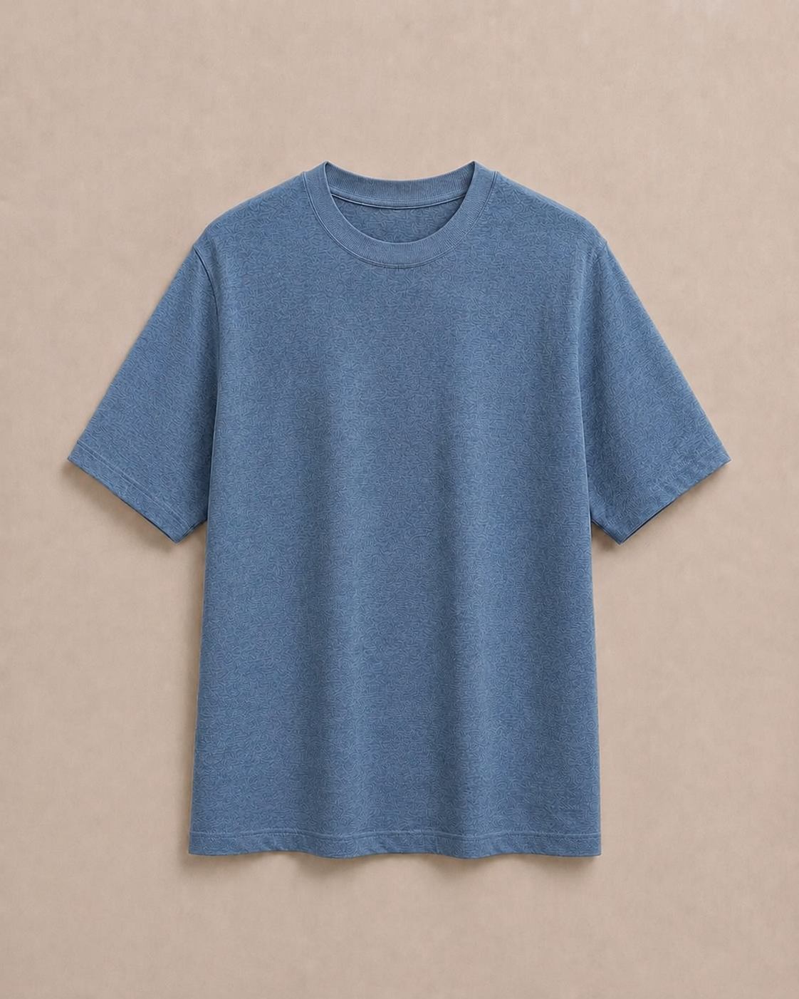 A Pure Hemp slate blue short-sleeve  t-shirt laid flat against a solid beige background. Hemp Horizon