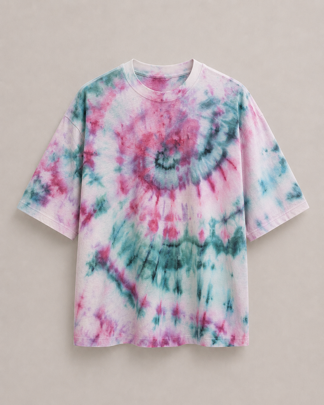 A short-sleeve t-shirt featuring a vibrant pink, teal, and white spiral  ice dyed pattern, displayed flat against a neutral beige background. Hemp Horizon