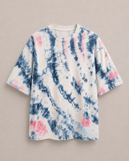 A short-sleeve t-shirt featuring a navy blue and pink ice-dye pattern on a white base, displayed flat against a neutral beige background. Hemp Horizon
