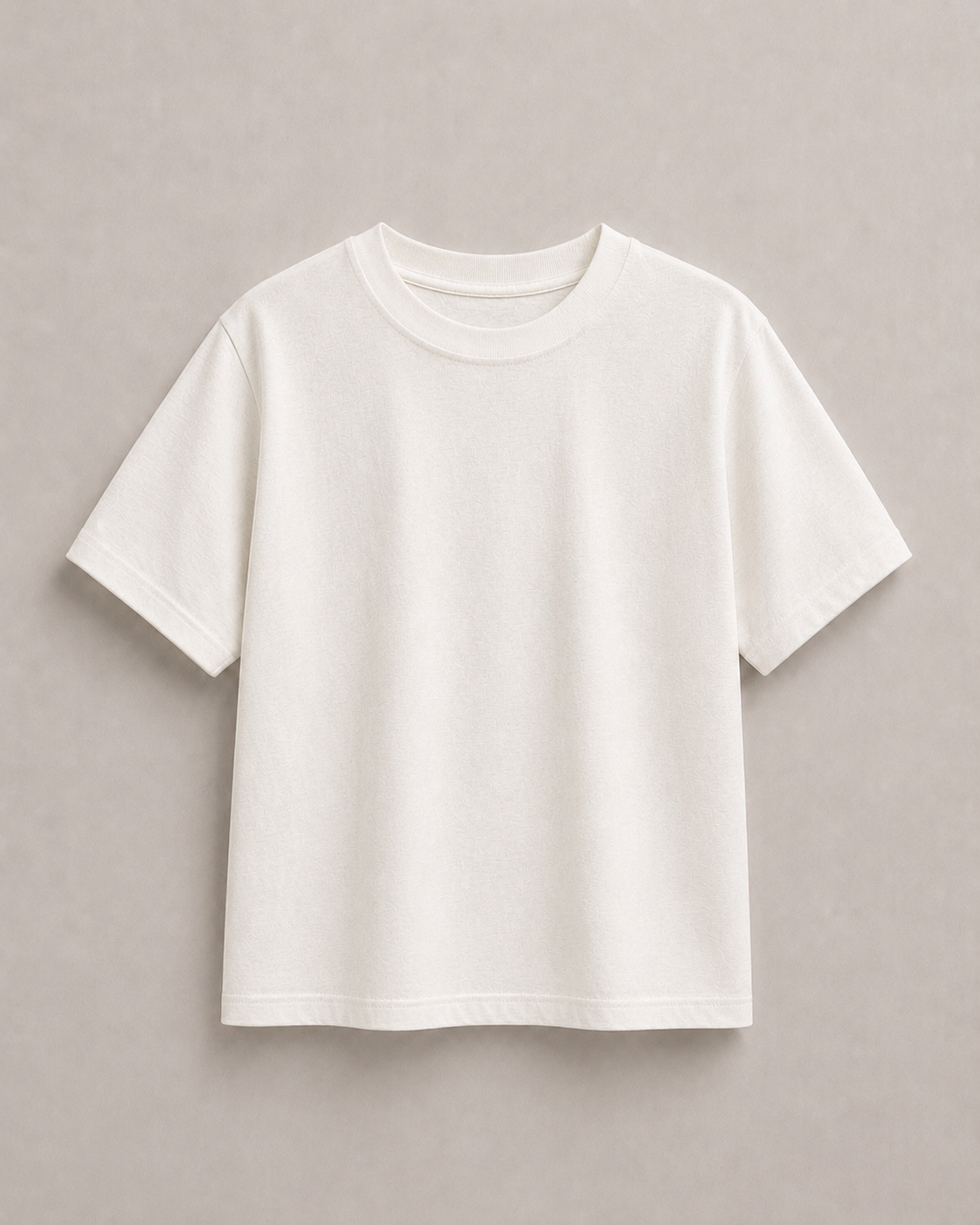A plain off white pure hemp short-sleeve t-shirt neutral light gray background. Hemp Horizon